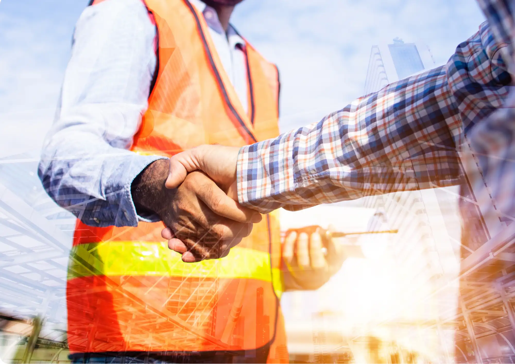 Partnership handshake on a construction site